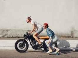 Teenagers riding a Motorcycle