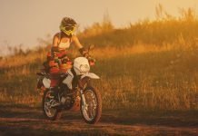 Riding a motorcycle has the same effect as exercise and meditation combined Happy female biker