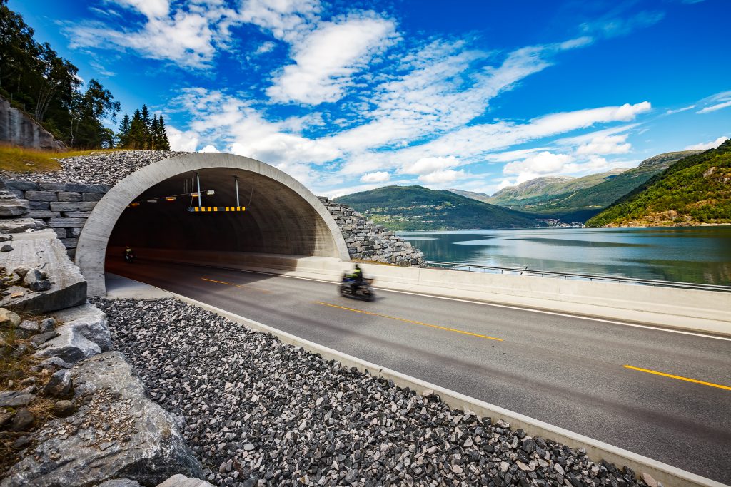 Road in Norway Biker racing on the track in the tunnel